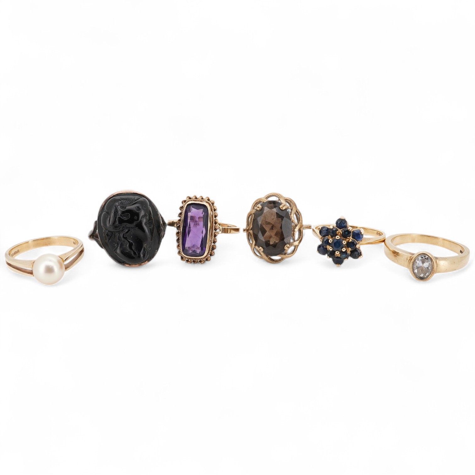 A collection of six gold rings